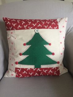 a pillow with a christmas tree on it