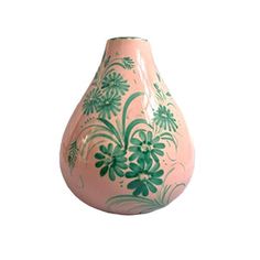 a pink vase with green flowers painted on the outside and inside, against a white background