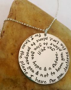 "DESCRIPTION: Bible Verse Scripture Extra Large 1 1/2\"Sterling Silver Round Jeremiah 29:11 Custom Hand Stamped Metal Necklace. This 1 1/2\" Solid Sterling Silver necklace is shown Polished on a Rolo chain in image one and with an Aged Finish on a Leather Chain in image two. You choose the finish and chain type and length. When choosing the chain, the + cloth option adds a polishing cloth for $3. The Bible Verse Scripture featured on this piece is Jeremiah 29:11, however any scripture or wording Handmade Sterling Silver Necklace For Commemoration, Meaningful Nickel-free Necklace, Stamped Pendant Necklace For Commemoration, Meaningful Nickel-free Round Necklaces, Inspirational Silver Round Pendant Jewelry, Inspirational Round Nickel-free Necklace, Nickel-free Inspirational Necklace, Sterling Silver Stamped Round Necklace, Commemorative Hand Stamped Silver Jewelry