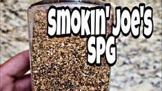 a person holding a jar filled with lots of sprinkles and the words smoki'n joe's spg above it