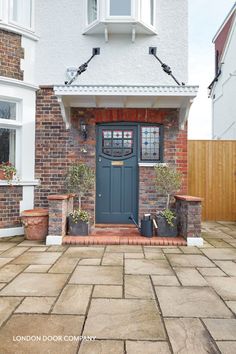 a blue front door on a brick house