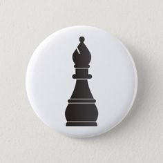 a button with a chess piece on it