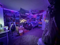 a room filled with lots of clutter and purple lighting on the ceiling above it