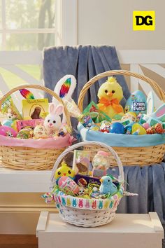 two baskets filled with stuffed animals sitting on top of a table