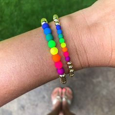 Neon and gold? Yes, please! Our best-selling Gold Bead bracelet gets a bright pop of color thanks to our UV active neon beads. That's right- they'll glow under black light! Add to your stack or wear alone but either way, these bracelets will light up your arm party! Bracelet measures 7" in circumference and is available in 2 different size beads. If you need a custom length, please send an email to hello@belleandten.com. Note: Neon Dark Periwinkle is a purplish-blue color. Some monitors might sh Make Clay Beads, Neon Bracelets, Gold Bead Bracelet, Neon Rainbow, Arm Party, Gold Bead Bracelets, Rainbow Beads, Sell Gold, Yes Please