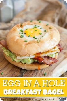 an egg in a hole breakfast bagel on a cutting board with text overlay