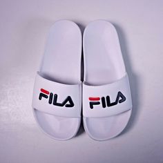 Fila Drifter Slide Sandals 1vs10000-125 White - New Without Box. Us Size 4 Men's == Us Size 5.5 Women's We Only Sell 100% Genuine Products, Sourced From Major Retailers. White Synthetic Slip-on Slippers, Casual White Slip-on Flip Flops, Casual White Slip-on Sport Sandals, White Non-slip Sport Sandals For Beach, Non-slip White Sport Sandals For The Beach, Comfortable White Slip-on Sandals, White Closed Toe Casual Flip Flops, Casual White Closed Toe Flip Flops, White Non-slip Casual Sport Sandals