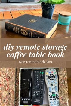 a remote control sitting on top of a coffee table next to a book and cup