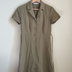 Great Quality Mini Dress With Tie Back. Olive Green Color And Button Up Front. Brand New (No Tags) And Never Worn. Casual Fitted Midi Dress With Covered Buttons, Casual Everlane Dresses For Daywear, Casual Fitted Dress With Covered Buttons, Everlane Summer Midi Dress, Fitted Midi Dress With Buttons, Elegant Fitted Everlane Dress, Casual Fitted Shirt Dress With Covered Buttons, Fitted Casual Shirt Dress With Covered Buttons, Puffy Sleeves Dress