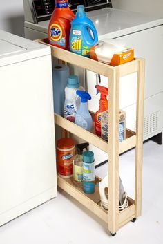 a kitchen cart with cleaning products on it next to a dishwasher and washing machine