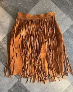 "Description: Live out your Janis Joplin flower power dreams in this gorgeous vintage sueded fringe skirt in near perfect condition. You do not want to miss out on this piece of history. Made by \"Cedars\" company, this is real suede with a smooth acetate lining. Perfect for costume or just for fun outfits! This skirt has a zippered  side and a button at the top.  Condition: Great! - one piece of fringe has been pulled off and about 3 pieces that a tad short but it is on the side of the garment Leather Fringe Skirt, 50th Bday, Fun Outfits, Fringe Skirt, Janis Joplin, Skirt Vintage, House Dress, Barn Style, Leather Fringe