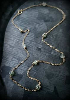 "Prehnite Lichen Necklace, 14k Gold Prehnite Station Necklace, Green and Gold Spring Necklace, 14k Gold Prehnite Layering Necklace, 16\" Lichen Necklace features sage green Prehnite Cubes, faceted for subtle sparkle, wrapped in solid 14k gold wire and interspersed in solid 14k Gold Cable chain. Circling the neck at 16\" , for lux ring of forest Lichen to layer with your insects and medallions. Size: Prehnite Beads are semi-translucent, laced with interesting inclusions formed when the sage green Delicate Green Jewelry With Natural Stones, Handmade Green 14k Gold Necklace, Handmade 14k Gold Green Necklace, Gold Prehnite Jewelry As A Gift, Green Amethyst Necklace For Gift, Insect Necklace, Spring Necklace, Necklace Green, Station Necklace