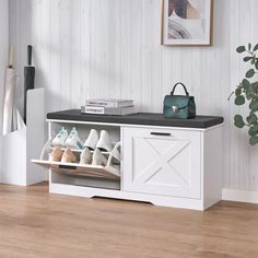 a white shoe rack with several pairs of shoes on it and a handbag next to it