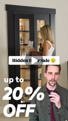 a man standing in front of a black cabinet with the words hidden d sale up to 20 % off