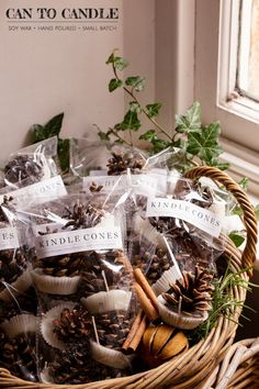 a basket filled with lots of different types of candies and pine cones in it