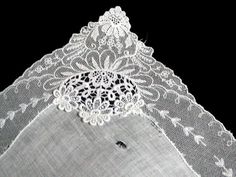 New old stock vintage wedding hanky with a fancy applique and lace border. Although never used, this hanky is slightly imperfect. Please view all photos, as you will see a couple of very small tears in the lace and a small tear in the linen center. Still very pretty, and perfect for a bride-to-be as her something old. All white, measuring 11 inches, and made of linen. Being sold AS IS, and priced accordingly. Vintage Lace Trim Handkerchiefs For Wedding, Lace Handkerchiefs With Lace Trim For Wedding, Vintage Wedding Handkerchiefs With Lace Trim, Lace Wedding Handkerchiefs With Lace Trim, Lace Wedding Handkerchiefs With Lace Work, Wedding Lace Handkerchief With Lace Work, Wedding Handkerchiefs With Lace Work, Vintage White Wedding, Wedding Hankies