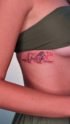 a woman with a tattoo on her stomach