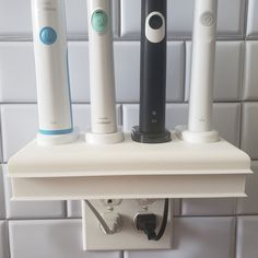 "Custom 3D printed electric toothbrush holder with slots for 4 Philips sonicare chargers.  Organize and hide your charger cords and free up valuable space.  Declutter your bathroom counter while still charging your toothbrushes.  This toothbrush holder is mounted by replacing your existing outlet plate with a custom design and printed plate that is provided with your purchase.  This innovation looks sleek, clean and modern! Color:  White Product Dimensions: 6.5\" x 4\" x 8.75\" Base:  Philips So Toothbrush Charging Station, Electric Toothbrush Charging Station, Storing Electric Toothbrushes, Electric Toothbrush Head Holder, Ceramic Electric Toothbrush Holder, Retainer Cleaner, Philips Sonicare Toothbrush, Plate Chargers, Sonicare Toothbrush