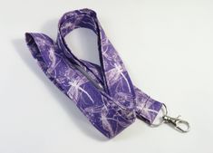 This cute lanyard has perfect design of dragonflies on purple. It is perfect for any occasion. You can leave me a convoy if you need a different size. You can have a wardrobe of lanyard to match your outfit. This lanyard is made of soft 100% cotton fabric to give a comfortable feel around your neck. This lanyard is easy to take care. You can spot clean and throw in a washer and hang dry. If you want you can iron and it is ready to use. These lanyards are perfect if you have metal allergy. Each of these lanyards will have a slight different pattern depending on where fabric is cut on pattern. This lanyard measures 21 inches long on one side and it is 3/4 inch wide or 42 inches long all over around neck. Multiple orders are welcome and I take custom orders too on all my lanyards. All the pro Adjustable Purple Badge Holders As Gift, Purple Dragonfly, Cute Lanyard, Cute Lanyards, Fabric Lanyard, Have Metal, Badge Holder, Dragonflies, Badge Holders Lanyard