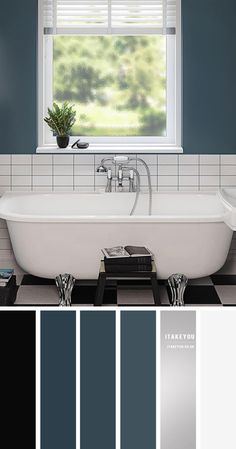 a bathroom with blue walls, white tub and black tile flooring in the center