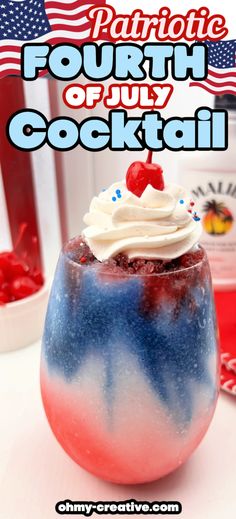 patriotic fourth of july cocktail in a glass with whipped cream and cherries on top