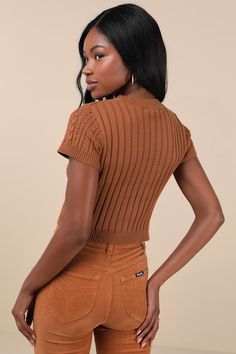 Your autumn style will be truly special a with trendy must-have like the Lulus Modish Ways Rust Brown Cable Knit Short Sleeve Sweater Top! This soft and stretchy sweater boasts a variety of classic designs, including cable, seed, and ribbed knit textures (plus pierced detailing), that makes this piece truly unique. A timeless crew neckline and a fitted, cropped bodice are framed by cute short sleeves, while contrasting ribbed knit trim at the neckline, cuffs, and hem completes the look. Fit: Thi Brown Knitted Crew Neck Top, Fall Cable Knit Tops For Layering, Soft Knit Fitted Tops For Fall, Fitted Soft Knit Tops For Fall, Brown Ribbed Knit Cardigan, Brown Cable Knit Crew Neck Top, Chic Cable Knit Stretch Tops, Ribbed Brown Tops For Fall, Brown Ribbed Tops For Fall