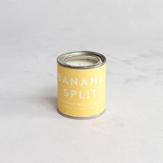 a can of banana split sits on a table