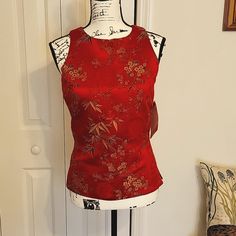 This Is A Beautiful Oriental Sleeveless Blouse In A Gorgeous Satiny Red Color. It Is Nwt. The Bust Measures 17 In. And It Is 22 In. Long. There Is A Button Closure At The Nape Of The Neck And A Zipper Closure Down The Back. Pristine Condition. Red Fitted Vest For Spring, Red Fitted Vest For Summer, Formal Fitted Silk Tank Top, Red Formal Tops For Summer, Red Sleeveless Tank Top For Night Out, Fitted Red Vest For Summer, Red Formal Summer Tops, Red Sleeveless Formal Tops, Silk Sleeveless Tank Top For Party