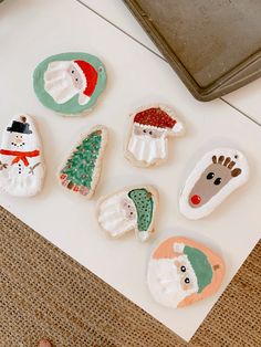 decorated cookies sitting on top of a white counter