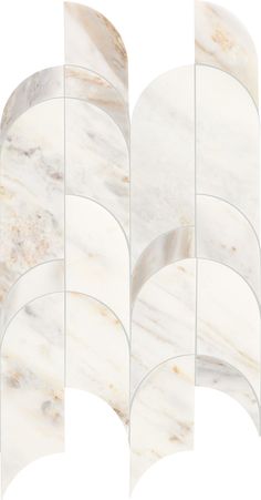 four pieces of white marble are arranged in the shape of an oval, with curved edges