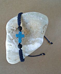 Blue Howlite Cross, Christian Bracelet, Cross Bracelet, Greek Orthodox Bracelet The Cross Bracelets are made with blue howlite cross, brown, black, gray, bordeaux and navy blue synthetic satin cord, matt black beads and silver tone metal beads. You can choose the cord color you want. ❥It is perfect for a gift to a friend or someone you love. SIZES: --------- Howlite cross: 12 mm x 15 mm Satin cord: 1 mm Black matt beads: 5 mm Metal silver tone beads: 3.2 x 2.6 mm Adjustable size in length with a Blue Spiritual Bracelet With Sliding Knot, Blue Spiritual Bracelets With Sliding Knot, Spiritual Blue Braided Bracelets For Gift, Spiritual Blue Braided Bracelets As Gift, Spiritual Blue Braided Bracelet As Gift, Handmade Adjustable Cross Bracelets, Blue Spiritual Friendship Bracelets With Sliding Knot, Blue Spiritual Friendship Bracelet With Sliding Knot, Blue Cross Bracelets As Gift