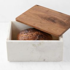 a loaf of bread in a marble box