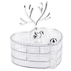 a clear plastic container with silver balls in it and an antlers head on top