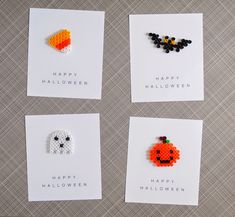 four halloween greeting cards with bead designs on them