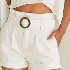 A Pair Of Denim Paperbag Shorts Featuring A High-Rise Waist, Pleating Throughout, Slanted Front Pockets, Zip Fly With Dual Button Closures, Cuffed Hem, And A Removable Pull-Through Belt With Tortoiseshell O-Ring Buckle. Content + Care Runs Small Fits Like A 25 - 100% Cotton Summer Cotton Bottoms With Belt, White Belted Shorts For Summer, White Belted Bottoms Short Length, White Belted Short Bottoms, White Belted Short Length Bottoms, Casual High Waist Shorts With Belt, Chic Summer Bottoms With Belt, Casual High Waist Belted Shorts, Casual High-waist Belted Shorts