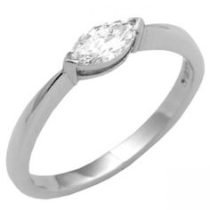 a white gold ring with a pear shaped diamond