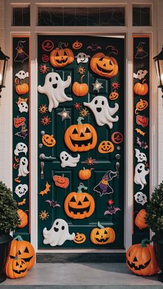 a door decorated with halloween decorations and pumpkins