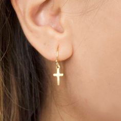 Single Cross Earring As Gift, Minimalist Cross Earrings For Gift, Elegant Pierced Cross Earrings, Minimalist Hypoallergenic Cross Earrings, Elegant Hypoallergenic Cross Earrings, Minimalist Gold Cross Earrings, Dangling Cross Earrings, Cross-shaped Huggie Earrings For Gift, Yellow Gold Cross Earrings For Pierced Ears