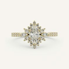 a yellow gold ring with an oval cut diamond surrounded by small white and yellow diamonds