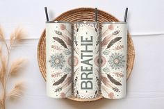 two stainless steel tumblers with the words breathe on them