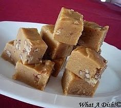 several pieces of peanut butter fudge on a white plate