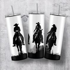 three tumblers with cowboy images on them