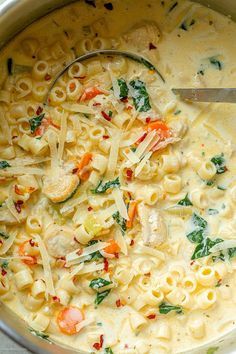 a large pot filled with pasta and vegetables