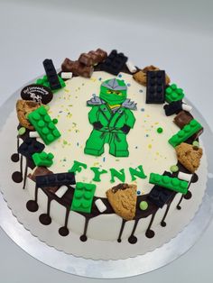 a birthday cake decorated with legos and chocolate