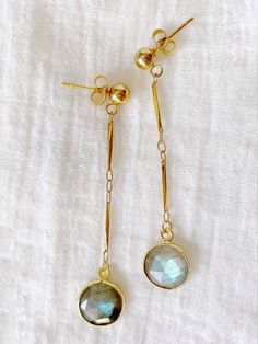 Long dangle earrings with two blue flashy labradorite stones gold framed. Gold brass vintage chain and hypoallergenic gold stainless steel ball studs. Gold Dangle Gemstone Linear Earrings, Handmade Gold Labradorite Earrings, Gold Gemstone Linear Earrings Gift, Gold Linear Gemstone Earrings As A Gift, Gold Labradorite Drop Earrings, Gold Labradorite Earrings, Vintage Chain, Labradorite Earrings, Statement Earring