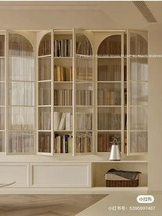 a living room filled with lots of white furniture and bookshelves on top of each other