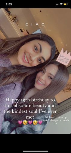 two young women are smiling and posing for the camera, one is wearing a crown on her head