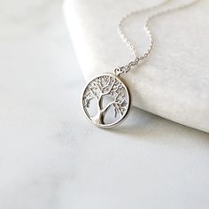 "Beautiful and lovely tree necklace. Made of semi-matte silver color finish tree round pendant with skinny rhodium plated brass chain. Simple and warm. Necklace will ship in a gift box. If you have any question, please feel free to contact me. Thanks :) ♥ Necklace length 15\"-22\" ♥ Tree pendant 5/8\" ♥ Rhodium plated over brass ♥Creation Time Fast shipping out within 1 - 3 days ♥ See more Rudiana Accessories Rudiana.etsy.com" Pretzel Necklace, Rose Gold Flats, Prom Necklaces, Necklace Tree, Gift Tree, Tree Necklace, Silver Tree, Infinity Necklace, Pendent Necklace