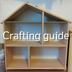 a wooden doll house with the words crafting guide on it's bottom corner