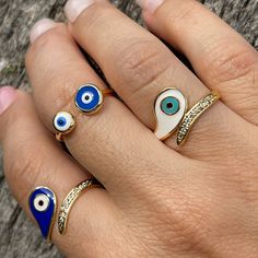 Ring Evil Eye, Eye Ring With CZ, Gold Plated Eye Ring, White And Blue Colors, Adjustable Ring, Evil Eye Ring, Joint Rings, Statement Rings, Minimalist Style, Greek Evil Eye Ring, Mexican Evil Eye Ring, Protection Ring, Lucky Eye Ring, Anillo De Mal De Ojo, Nickel Free, Hypoallergenic. Please Also Check Out Our Other Ring Options 👇🏼 https://www.etsy.com/shop/ShineOnYouStore?section_id=29271417 This evil eye ring is ADJUSTABLE. This is suitable for every sizes. This evil eye ring can be used as JOINT RINGS as well. It is completely Handmade. Evil Eye...🧿 It is a BLUE bead used as a talisman which is believed that it would PROTECT you against the Evil-eye. Evil-eye superstition comes from very early times and it can be found in most of the cultures in the world. To prevent this unfortunate Blue Stackable Enamel Ring, Blue Crystal Open Ring Gift, Blue Stackable Open Midi Rings, Blue Open Midi Rings, Handmade Blue Open Stackable Rings, Blue Evil Eye Ring Jewelry, Blue Adjustable Crystal Promise Ring, Adjustable Blue Crystal Promise Ring, Blue Open Crystal Ring